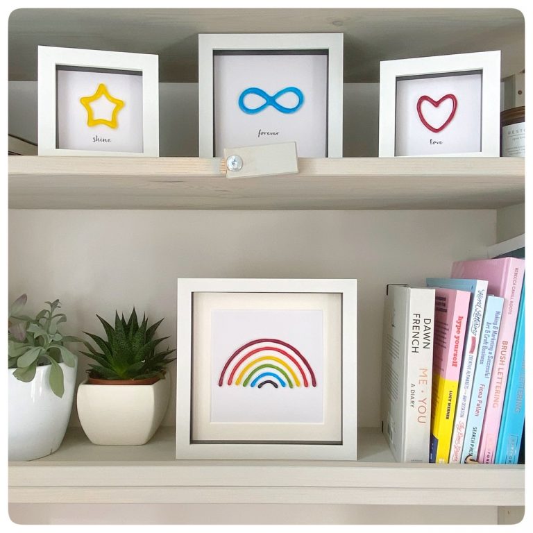 Collection of colourful glass framed pictures